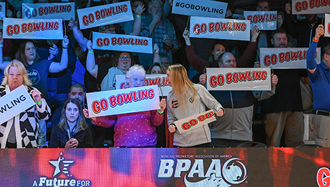 Fans with Go Bowling signs at U.S. Open
